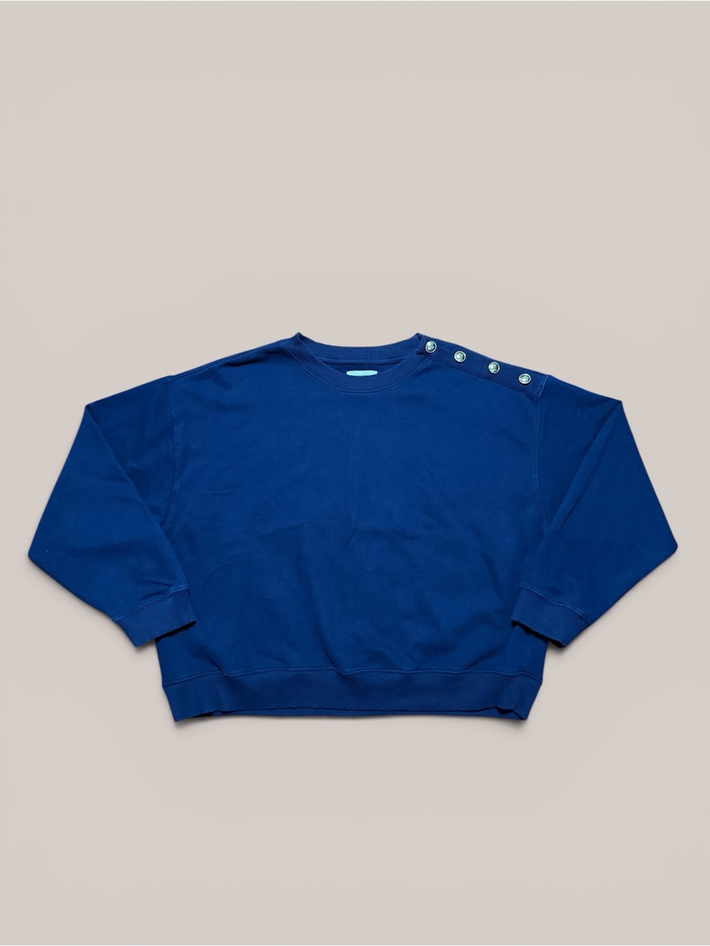 American Eagle navy blue crewneck with gold button details on shoulder